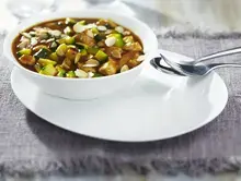Sauté de porc au curry et amandes grillées